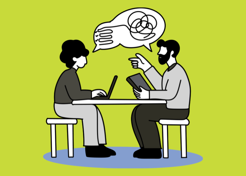 Illustration of two colleagues sitting at a table with a laptop and tablet, discussing work while a speech bubble with tangled lines represents complex communication or confusion.