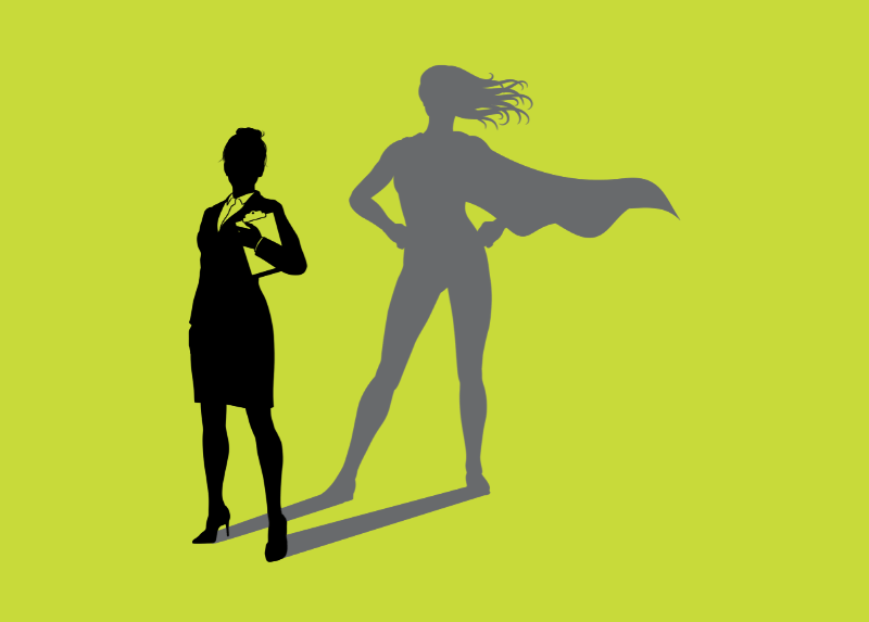 Silhouette of a professional woman standing confidently, with a larger superhero shadow behind her wearing a cape, symbolising hidden strength and potential.