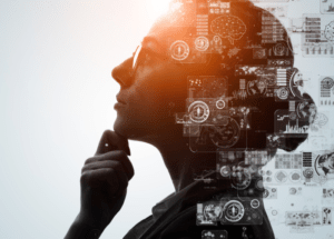 Woman looking pensively with digital graphics overlayed
